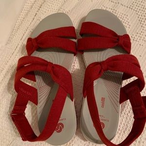 Red sandals. Clark’s Cloudsteppers.  NEVER WORN